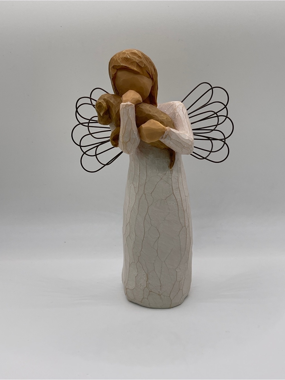 Willow Tree Angel of Friendship holding a Dog